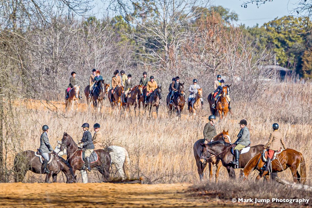 Fox hunt riders gathering in field